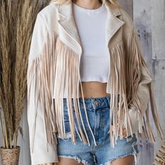 As Country As It Gets With This Amazing Fringe Jacket. You'll Sure Stand Out Everywhere You Go. Suede Moto Fringe Jacket Jacket Is A Cream/Sand Color. Material: 90% Polyester And 10% Spandex Beige Fringed Winter Outerwear, Cream Fringe Outerwear For Winter, Winter Cream Outerwear With Fringe, Chic Beige Outerwear With Fringe, Chic Beige Fringe Outerwear, Spring Cream Outerwear With Fringe, Cream Fringe Outerwear For Spring, Beige Long Sleeve Outerwear With Fringe, Spring Cream Fringe Outerwear