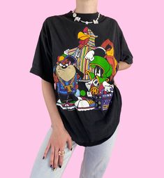 Vintage 90s Looney Toons Taz Hip Hop Short Sleeve Crewneck T-shirt FREE SHIPPING  Pullover closure, good condition - has light wear as seen in pics, hole on back of shirt  Brand - Pro Spirit Tag size - Large Seen on size small, 5'4 - (check measurements for best fit)  Measurements (laying flat) Chest - 21 in Length - 29 in #90staztshirt #hiphop #looneytoons #90slooneytoonstshirt #taztshirt *i try to include all noted flaws, but vintage is expected to have some wear from age and use (please ask a Vintage Cartoon Print T-shirt For Streetwear, Vintage Black Top With Cartoon Print, Fun Multicolor Tops For Streetwear, Fun Cartoon Print Tops For Streetwear, Vintage Summer Tops With Character Print, Vintage Character Print Tops For Summer, Vintage Black T-shirt With Cartoon Print, 90s Inspired Streetwear Tops With Funny Print, Fun Cartoon Print T-shirt For Streetwear