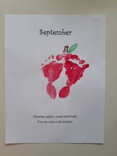 an apple handprint on a piece of paper with the words september written in it