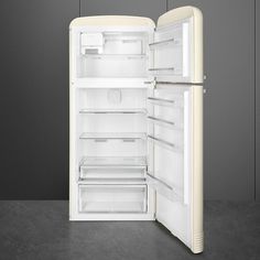 an open refrigerator with its door wide open on a gray surface, showing the interior