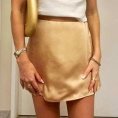 Brand New Never Worn Chic Gold Mini Skirt, Chic Gold Mini Length Bottoms, Elegant Gold Mini Skirt For Spring, Mini Skirt For Date Night In Spring, Gold Mini Skirt For Summer, Chic Gold Skirt For Spring, Elegant Brown Skirt For Date Night, Beige Mini Skirt For Summer Night Out, Beige Mini Skirt For Night Out