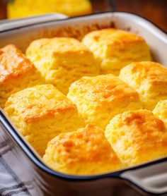 a casserole dish filled with cornbread muffins