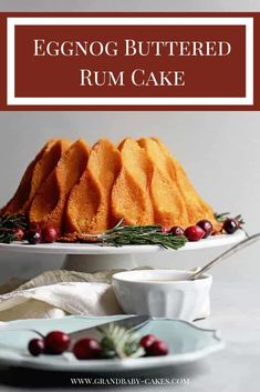 a bundt cake sitting on top of a white plate next to bowls of cranberries