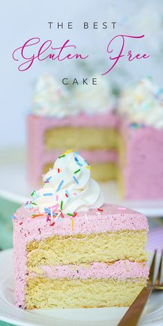 a piece of cake with pink frosting and sprinkles on top, sitting on a plate