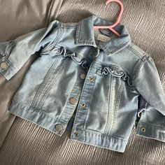 Never Worn Childrens Place Jean Jacket For Girls Size 6-9 Months Super Cute And Nice Jean Material Long Sleeve Outerwear For Playtime In Spring, Cute Outerwear For Spring Playtime, Spring Playtime Outerwear With Pockets, Long Sleeve Denim Jacket With Pockets For Playtime, Fall Denim Jacket For Playtime With Long Sleeves, Long Sleeve Denim Jacket For Fall Playtime, Cute Fitted Outerwear With Pockets, Blue Long Sleeve Outerwear With Ruffles, Cute Blue Fitted Outerwear