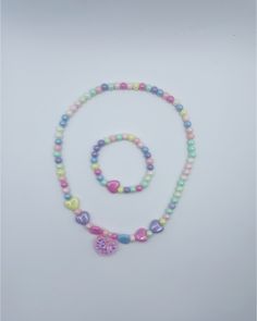 Gender: Girls Type: Necklace/Bracelet Material: plastic jewelry set Product Description: 1 necklace + 1 bracelet. *Jewelry set, colorful plastic material bead necklace, center of necklace has pink heart in delicate glitter, girls bracelets, girls birthday party jewelry gift. pattern/shape: love heart Occasion: party, birthday, gifts or any special occasion or as you like. Cute Multicolor Jewelry With Heart Beads, Cute Multicolor Heart Beads Jewelry, Cute Multicolor Plastic Necklaces, Multicolor Beaded Plastic Necklace, Cute Handmade Plastic Necklace, Sweet Multicolor Heart-shaped Jewelry, Playful Colorful Jewelry With Heart Beads, Plastic Heart Beads Jewelry For Gifts, Cute Multicolor Heart-shaped Jewelry