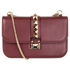 100% authentic Valentino Rockstud Glam Lock flap bag in burgundy calfskin features edgy, oversized pyramid studs in light gold-tone. A chain-link pull-through strap can be used as a shoulder strap, worn across the body, or removed to carry this bag as an large clutch. Opens with a pinch lock closure under the flap and is lined light beige canvas with one zipper pocket against the back and two open pockets against the front. Has been carried and is in excellent condition. Comes with dust bag. Mea Hand Bags Ideas, Valentino Rockstud Bag, Valentino Crossbody Bag, Designers Bags, Large Clutch, Glam Bag, Valentino Rockstud, Hand Bags, Leather Bags