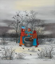 three women are standing in the snow near a barrel