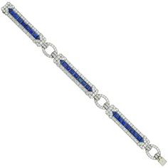 An Important Art Deco sapphire and diamond bracelet by Yard, consisting of three rectangular-shape flexible panels, each with a central row of calibre-cut sapphires surrounded by a diamond-set border of geometric design, connected by three oval-shaped diamond-set links, the sapphires estimated to weigh 10 carats in total, the old brilliant-cut diamonds estimated to weigh 11 carats in total, all mounted in platinum, signed Yard, circa 1930, measuring approximately 19 x 1.2cm, gross weight 34 grams. An Art Deco sapphire and diamond platinum bracelet in very good condition. Unmarked, bracelet tested as platinum and 18ct gold clasp tongue. This splendid Art Deco bracelet comes from the collection of Bentley & Skinner, the London jewellers by appointment to both Her Majesty the Queen and His Ro Bracelets Tennis, Bracelet Art, Bvlgari Jewelry, Platinum Bracelet, Bracelet Tennis, Vintage Tennis, Art Deco Bracelet, Art Deco Diamond Rings, Sapphire Bracelet