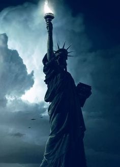 the statue of liberty stands in front of a cloudy sky with lightning striking behind it