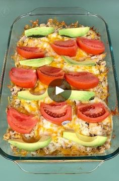 a casserole dish with tomatoes, avocado and cheese