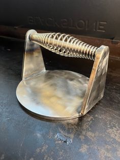 a metal object sitting on top of a table