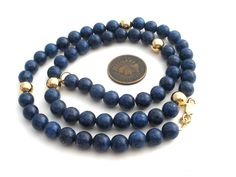 Blue Gemstone Vermeil Jewelry - This is a strand of 7mm lapis lazuli and gold over sterling silver beads. Necklace is 18.5" long, beads are 7.5 mm wide, hallmarked 925 Canada and weighs 37 grams. Sapphire Jewelry With 8mm Beads, Lapis Lazuli Round Beaded Necklaces, Lapis Lazuli Necklaces With 8mm Beads, Necklace With 8mm Round Lapis Lazuli Beads, Lapis Lazuli Necklace With 8mm Beads, Formal Lapis Lazuli Necklace With Round Beads, Formal Lapis Lazuli Beaded Necklace, Single Strand Lapis Lazuli Round Bead Jewelry, Classic Blue Round Beads Jewelry