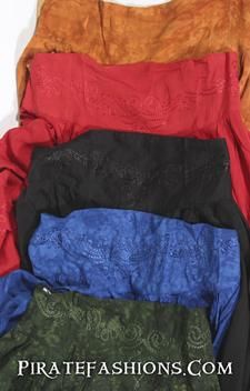 four different colors of clothing laying on top of each other