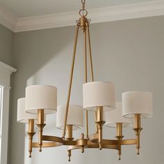 a chandelier with five lamps hanging from it