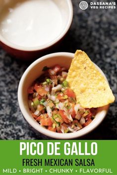 a bowl filled with salsa next to a bowl of guacamole