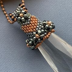 the beaded necklace is made with glass beads