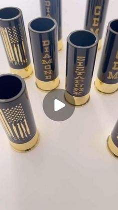 several black and gold cups with american flags on them