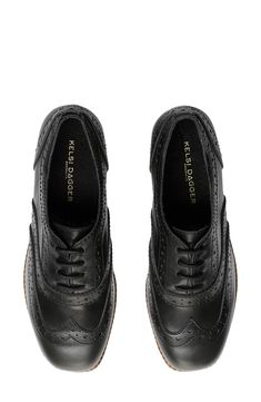 Offering a modern twist on the classic wingtip, this brogued leather oxford is elevated on a vertically stacked platform and heel. 2" heel; 1" platform Leather upper/textile lining/recycled synthetic sole Imported Classic Plain Toe Lace-up Platform Shoes, Office Wingtip Lace-up Shoes With Contrast Sole, Formal Plain Toe Platform Lace-up Shoes, Black Platform Wingtip Oxfords, Black Wingtip Platform Oxfords, Textured Sole Wingtip Oxfords, Office Wingtip Lace-up Shoes With Lug Sole, Wingtip Oxfords With Contrast Sole For Work, Lace-up Wingtip Shoes With Lug Sole