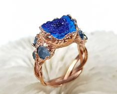 DETAILS  ★ US size: 7 3/4; ★ British: P 1/2; ★ Inside diameter: 17.97mm; ★ Inside circumference: 56.45mm; ★ Azurite crystal cluster ★ Special braided ring band ★ Electroformed and electroplated with copper ★ Naturally oxidized ★ Coated with protective lacquer to protect patina layer and to reduce chance of finger staining (green fingers) ★ What you see is what you get ★ International Shipping available worldwide! ★ Gift ready packaging Electroformed Jewelry is the combination of art and science. Unique Blue Crystal Round Ring, Unique Blue Crystal Promise Ring, Unique Blue Crystal Ring For Anniversary, Unique Blue Crystal Wedding Ring, Blue Sapphire Unique Promise Ring, Unique Blue Sapphire Promise Ring, Handmade Aquamarine Blue Rings, Handmade Blue Aquamarine Rings, Handmade Blue Crystal Ring For Wedding