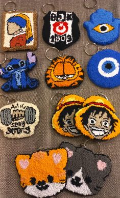 several embroidered badges are displayed on a table with eyeballs and other items in the background