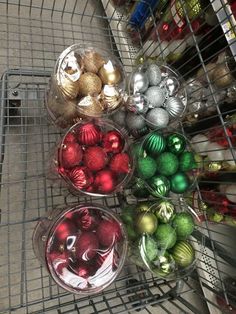 a shopping cart filled with assorted christmas ornaments