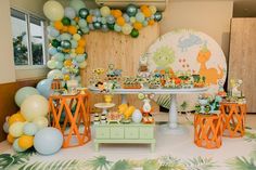 a baby shower party with balloons and decorations