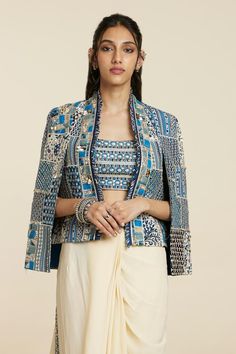 Blue woven jacket with floral, thread, beads and sequins embroidered patchwork.
Components: 1
Pattern: Woven, Embroidered
Type Of Work: Floral, Thread, Beads, Sequins
Sleeve Type: Flared Sleeves
Color: Blue
Other Details: 
Note: Inner and skirt worn by the model are not for sale.
Occasion: Party,Cocktail - Aza Fashions Luxury Embroidered Festival Outerwear, Luxury Bollywood Traditional Wear With Embroidered Sleeves, Luxury Traditional Festival Blazer, Luxury Traditional Wear With Woven Motifs For Transitional Season, Luxury Traditional Wear With Woven Motifs For Festive Season, Luxury Blue Outerwear With Zari Work, Luxury Embroidered Outerwear For Festivals, Luxury Festive Embroidered Jacket Dress, Luxury Traditional Blue Outerwear