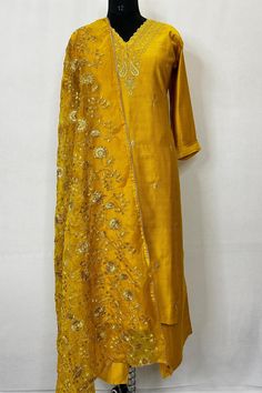 Silk Blend Mustard Embroidered Straight Kurta With Trousers and Dupatta Indian Wedding Wear Salwar Kameez / Indian Wedding Dress / Plus Size Cotton Kurta Dress Traditional Indian Wear / Salwar Kameez Dupatta / Kurti Palazzo Set The set contains: 1 Straight Kurta 1 Trousers 1 Dupatta Kurta: The mustard yellow straight Kurta has a V neck design with embroidered details in front. The Kurta measures till calf length and has straight hemline. Sleeve length :  3/4 Sleeves Trousers :  Solid trousers has partially elasticated waistband and slip on closure. Also comes with two pockets.  Dupatta : Embroidered Dupatta Material : Kurta :  Silk Blend Trousers :  Silk Blend Dupatta : Silk Blend Fabric Care : Hand wash Please see the size information below to choose a perfect size for yourself:  (size in Festive Slub Silk Churidar With Resham Embroidery, Slub Silk Sets With Dori Work For Wedding, Gold Embroidered Slub Silk Unstitched Suit, Gold Slub Silk Salwar Kameez With Resham Embroidery, Gold Salwar Kameez With Resham Embroidery In Slub Silk, Gold Salwar Kameez With Gota Work In Slub Silk, Gold Slub Silk Churidar With Gota Work, Gold Slub Silk Sets With Resham Embroidery, Gold Churidar With Gota Work In Slub Silk