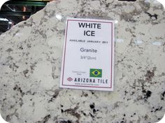 a white granite sign on display in a store