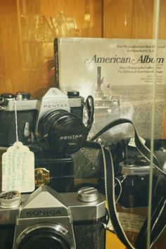 an old camera and other items are on display