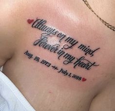 a woman with a tattoo on her chest that says, i am sorry to you