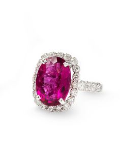 an oval shaped ruby and diamond ring