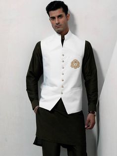 <p>Waistcoat Color: White<br />Waistcoat Fabric: PC Suiting Fabric<br />Smart looking designer waistcoat features delicate embroidery accent the front<br />Fancy button closure<br />Complement with black kurta and pajama</p> <p><br /><br /><strong>Additional Accessories:</strong><br />Peshawari Sandal / Khussa: <strong>US$50</strong></p> Groom Waistcoat, Embroidered Waistcoat, Nikah Ceremony, Wedding Waistcoats, Black Kurta, Fancy Buttons, Navy Logo, Suiting Fabric, Raw Silk