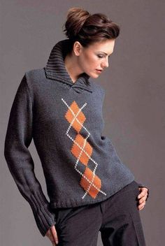 a woman wearing a sweater with an argyle pattern