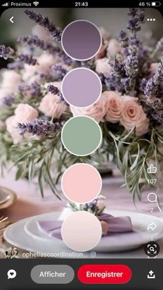 a vase filled with lots of flowers on top of a table next to plates and utensils