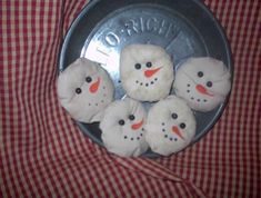 snowmen made out of doughnuts sitting in a pan