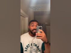 a man taking a selfie in the mirror