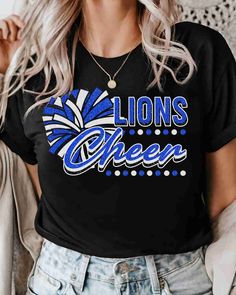 Looking for a unique and high-quality heat transfer design for your Lions? Look no further than the Lions DTF Transfer! Crafted from top-quality materials, this heat transfer design is sure to stand up to even the toughest wear and tear. Whether you're cheering on your team from the sidelines or hitting the town with friends, this DTF transfer is sure to turn heads and show off your school spirit. Whether you're looking for school spirit designs, sports team transfers, or something entirely uniq Black Graphic Print Top For Cheerleading, Black Glitter T-shirt With Short Sleeves, Black Glitter Short Sleeve T-shirt, Trendy Black T-shirt With Glitter Print, Trendy Black Glitter Tops, Black Glitter Print Tops For Cheerleading, Black Glitter Print T-shirt For Cheerleading, School Spirit Shirts Designs, Cheer Pom Poms