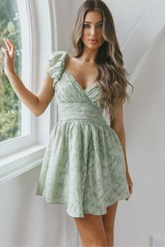 Green Backless Ruffled Dress, Green Backless Ruffle Dress, Backless Dress With Ruffle Hem For Garden Party, Flirty Dresses With Ruffled Straps For Garden Party, Backless Ruffle Dress For Casual Occasions, Chic Dress With Ruched Bodice And Ruffled Straps, Flirty Ruched Fit And Flare Dress, Flirty Fit And Flare Ruched Dress, Backless Ruffle Dress For Garden Party