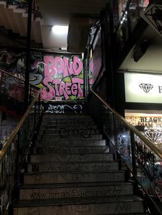 the stairs are covered with graffiti and stickers