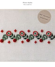 an embroidered pattern with red flowers and green leaves