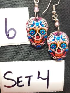 HANDMADE SUGAR SUGAR EARRINGS set 4 --choose from #1-9 and that exact one you will receive :) If you would like many please message us :) DETAIL IS AMAZING! NOT ONE IS THE SAME! COOLER IN PERSON! Set 4 Sugar Skull Jewelry Diy, Handmade Earrings For Day Of The Dead, Polymer Clay Sugar Skull Earrings, Sugar Skull Necklaces, Handmade Skull Earrings For Day Of The Dead, Sheep Art, Horse Decor, Horse Lover, Sugar Skull