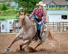 a woman riding on the back of a brown horse