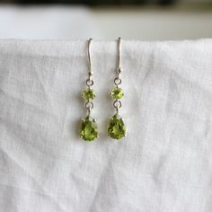 Earrings Green Stone, Green Gem Earrings, Sterling Silver Gemstone Earrings For May Birthstone, Green And Gold Earrings, Green Dangle Earrings, Peridot Earrings As A Gift, Peridot Teardrop Earrings For May Birthstone, Green Teardrop Birthstone Earrings, Teardrop Peridot Earrings For May Birthstone