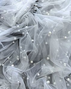 White Pearl Tulle Fabric by the Yard - Beaded Pearls Fabric 58'' Wide - White Tulle Lace Fabric with Pearls for Bridal veil, Wedding Dress. High quality, heavy pearls on 2 way stretch mesh. With our high-quality tulle you can create gowns, bridal veils, wedding dresses, prom dresses, Quinceanera dresses, stage costumes, bows, DIY projects, crafts, girl dresses, event decorations and beyond. The fabric is very soft and elegant. The rivets securely attach the beaded pearls to the tulle fabric. She White Tulle Fabric, Veil Wedding Dress, Dresses Event, Veils Wedding, Bows Diy, Veil Wedding, Event Decorations, Beaded Tulle, Dresses Quinceanera