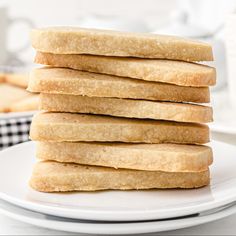 a stack of cookies sitting on top of a white plate