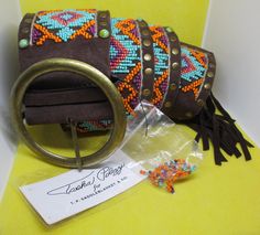 Never Worn Vintage Tasha Polizzi women's wide belt with original tag wide Southwestern seed beaded faux turquoise studs brass studs, brass belt buckle chocolate brown genuine suede leather belt. Length 41 & 1/2 inches. Length with fridge adds 6 & 1/4 inches to the length. Total length 47 & 3/4 inches. Width  3 inches.  I offer multiple-item order shipping discounts. Wide Belts For Women, Tasha Polizzi, Brass Belt, Brass Belt Buckles, Belt Length, Rhinestone Belt, Studded Belt, Unique Flowers, Suspender Belt