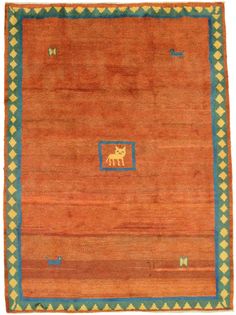 an orange and blue rug with small animals on the border, in front of a white background