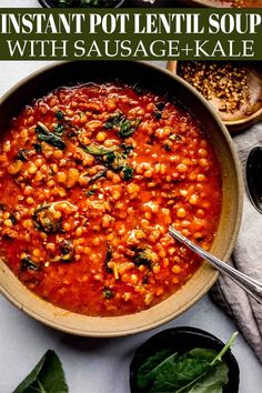 a bowl filled with beans and spinach on top of a table